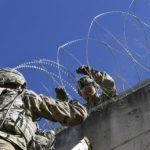 Soldiers install concertina wire barricade at Hidalgo port of entry. DoD photo by Daniel Hernandez.