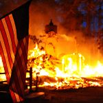 Flag in front of burning structure. Black Forest Fire. DoD photo by Master Sgt. Christopher DeWitt, U.S. Air Force.